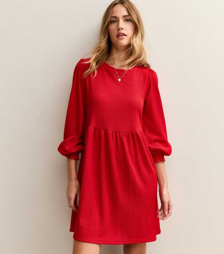 red smock dress Camelia Cotton Smocked The vibrant red color adds a pop of personality to any outfit Bright Red Long Sleeve Smock