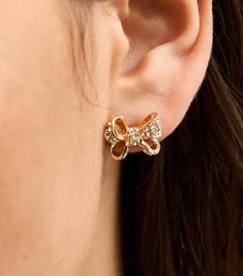 Gold Tone Diamante Bow Stud Earrings