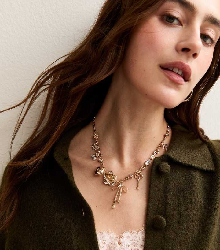 Gold Tone Bow Key Charm Necklace