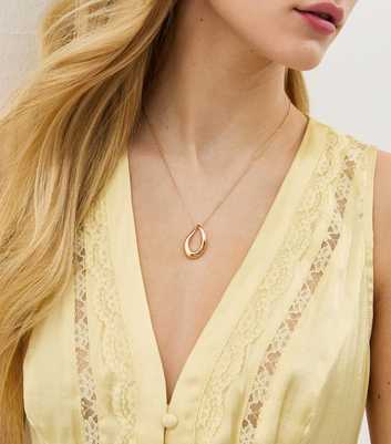 Gold Tone Abstract Oval Pendant Necklace