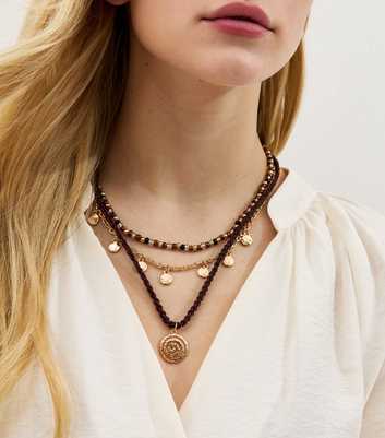 Gold Tone Layered Necklace with Swirl Charm