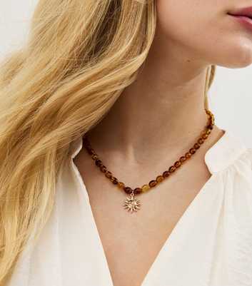 Brown Beaded Sun Pendant Necklace