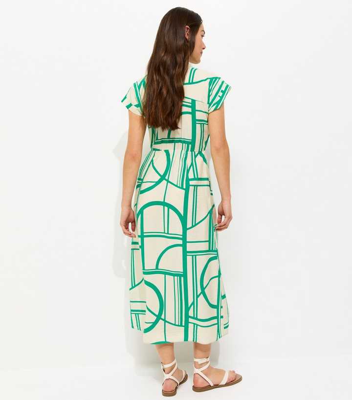 slim fit dress slacks Buy Green Cotton Geometric Placement Print Dress Online main image 1