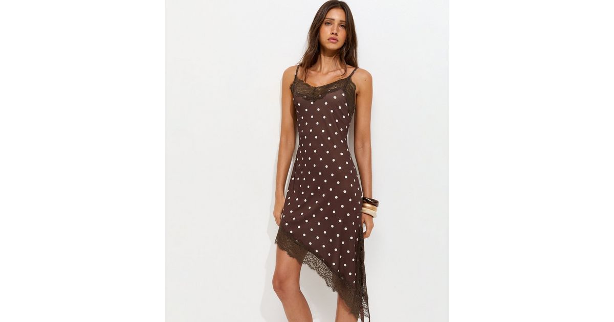 Dark Brown Polka Dot Asymmetric Hem Mini Dress | New Look Dark Brown Polka Dot Asymmetric Hem Mini Dress | New Look
