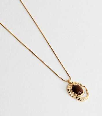 Gold Tone Brown Long Beaten Oval Pendant Necklace